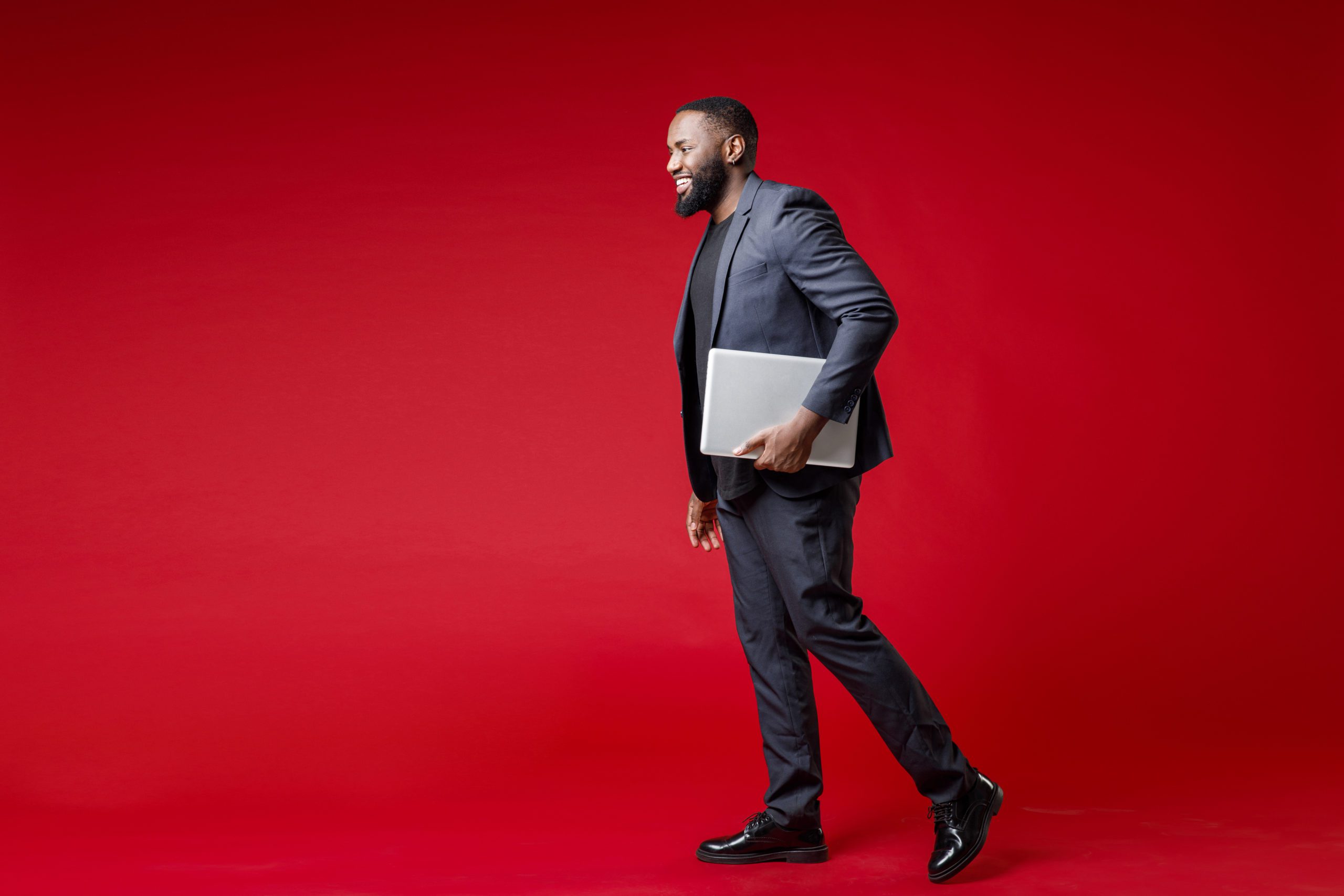 Man In A Suit With A Notepad